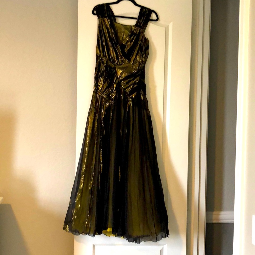Anna Molinari Black Gold Gown with high slits.